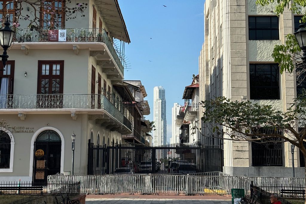 Old colonial buildings in Casco Viejo, Panama City, with the skyline visible in the background