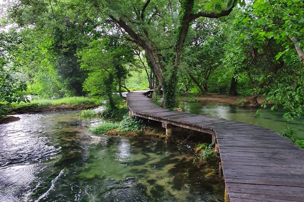 The winding wooden path leading over the waters at Krka National Park