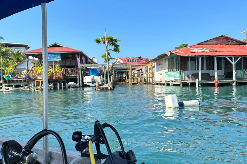 View from a boat of the huts lining Bocas Del Toro