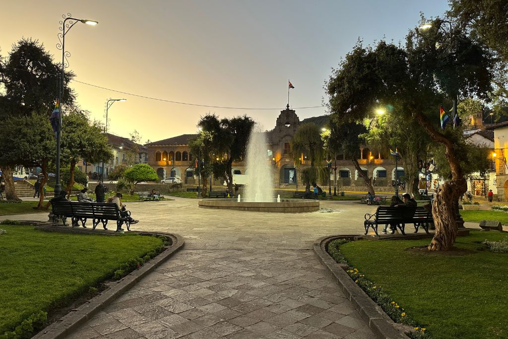A fountain at sunset on plaza Regocijo in Cusco